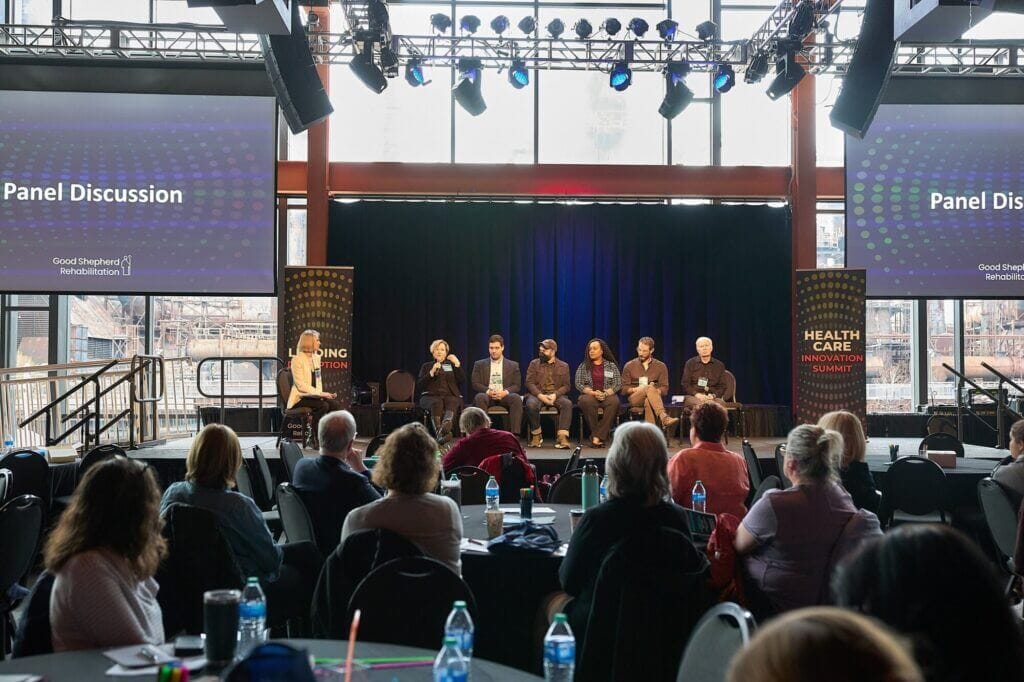 Panel of speakers on stage