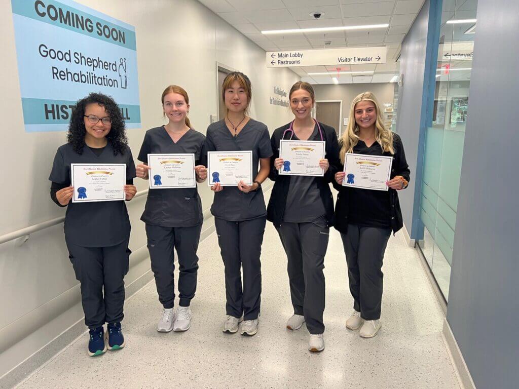 A group of five Nurse Externs showing off their certificates following their 2024 graduation
