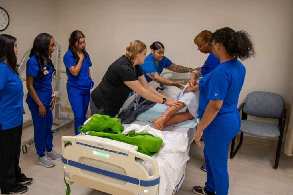 Certified nursing assistant (CNA) candidates undergo training