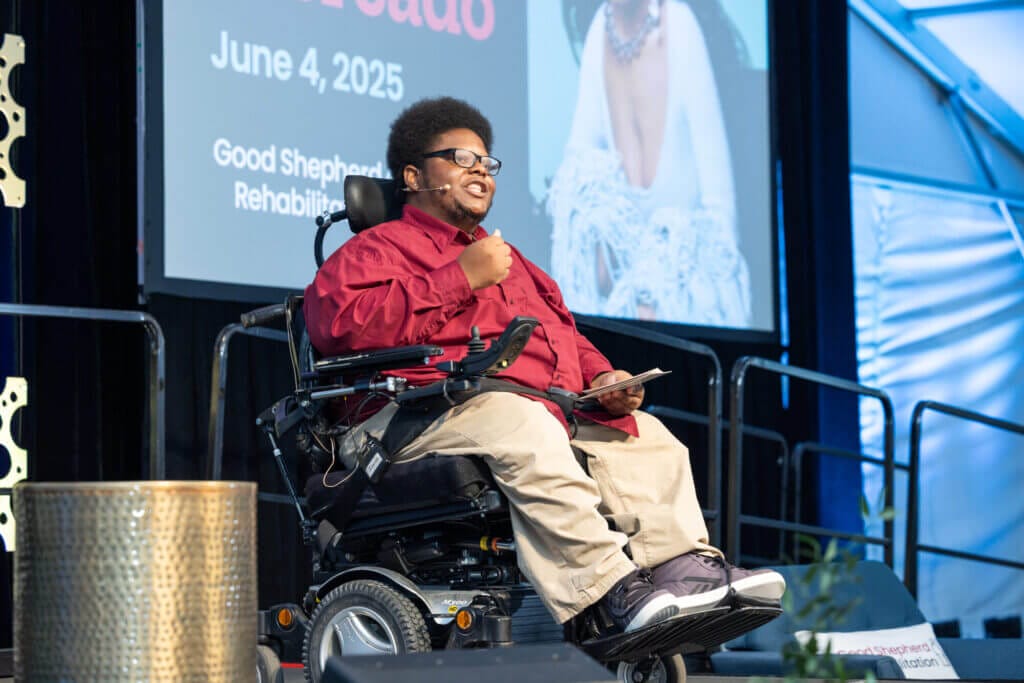 Isaiah Natale speaks on stage