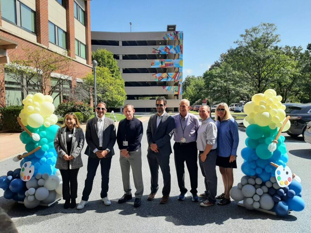 (Left to Right) Gail Vivar of Sen. Nick Miller's office; Allentown Mayor Matt Tuerk; Good Shepherd Rehabilitation President & CEO Michael Spigel; Rep. Mike Schlossberg; Lehigh County Executive Phil Armstrong; Rep. Peter Schweyer; and Jennifer Mann pose for a photo with Good Shepherd's mural visible in the background