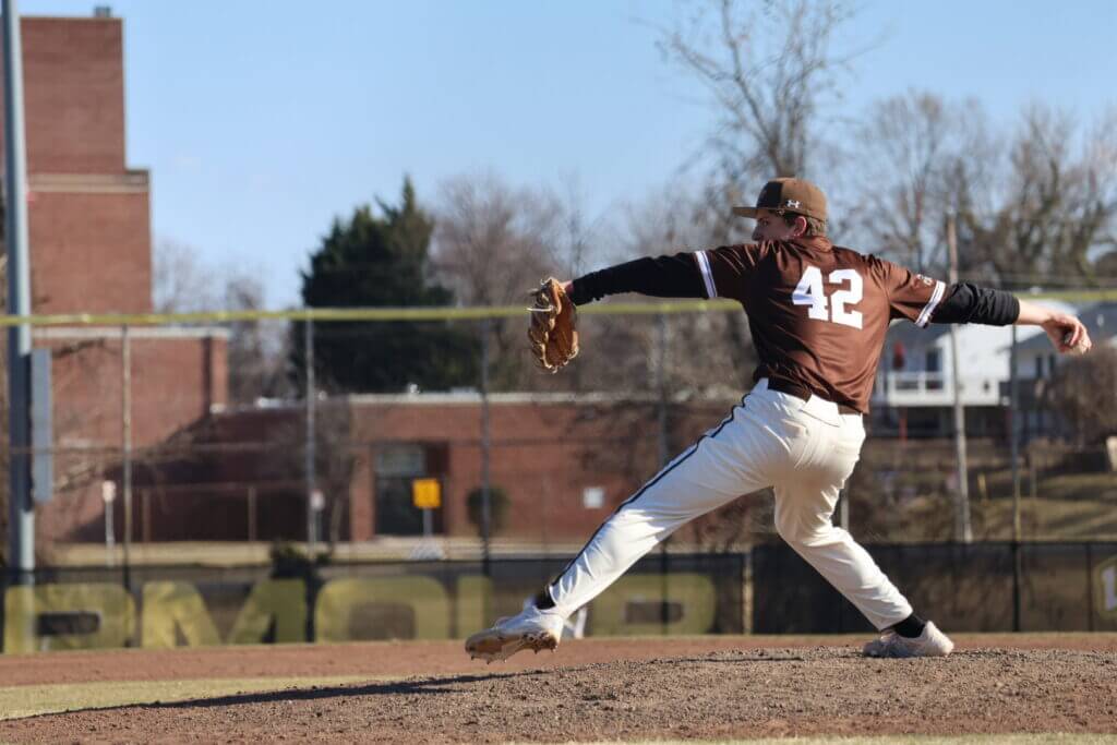 Noah wearing jersey number 42 is pitching for Lehigh University on a sunny day at an outdoor baseball field.