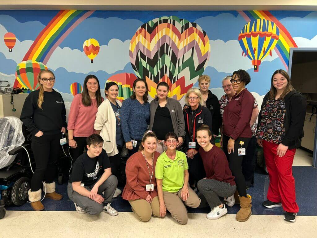 Tammy Kissel, Raker Spirit Award recipient with her colleagues